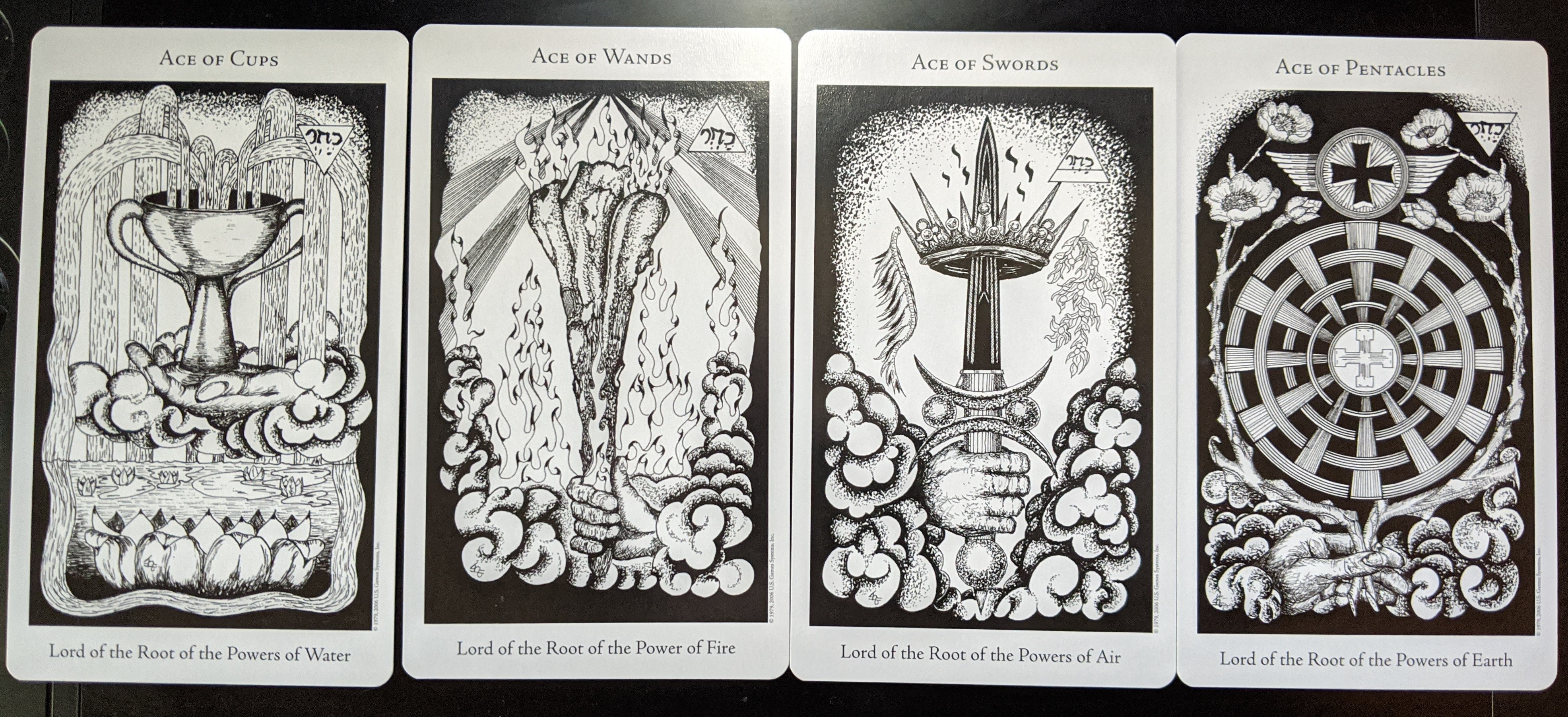 [Pictured: The Ace of Cups, the Ace of Wands, the Ace of Swords, and the Ace of Pentacles from the Hermetic Tarot.]
